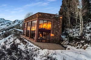 Snow covered property with a mountain view