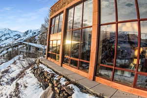 Snow covered property with a mountain view