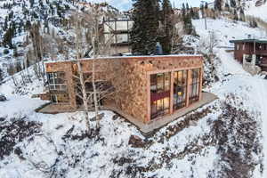 View of snow covered rear of property