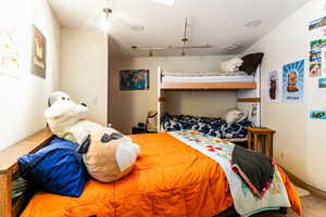 Bedroom featuring carpet flooring and rail lighting