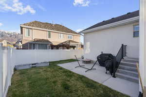 View of back yard featuring a mountain view and a patio