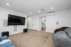 Basement Living room with a wall unit mini-split unit