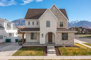 View of front of property featuring a mountain view and covered porch