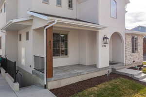 Doorway to property with covered porch