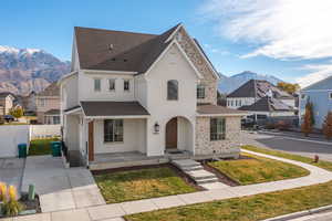 View of front of home featuring a mountain view and a porch