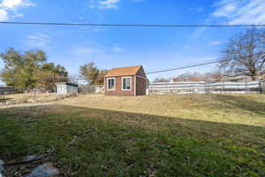 View of yard with an outbuilding