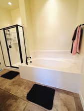 Bathroom featuring independent shower and bath