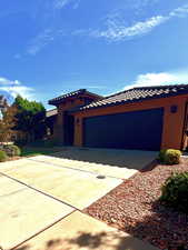 View of front of property with a garage