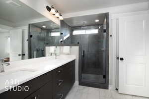 Primary bathroom with vanity and walk in shower