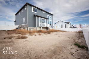 Rear view of house featuring central AC unit