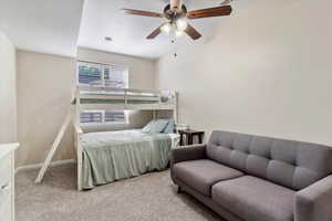 Bedroom with light carpet and ceiling fan