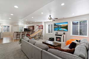 Living room featuring light hardwood / wood-style flooring and ceiling fan