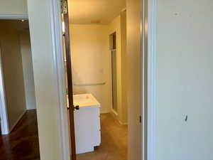 Bathroom with vanity and a shower with shower door