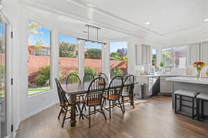 Sunroom with sink and a healthy amount of sunlight