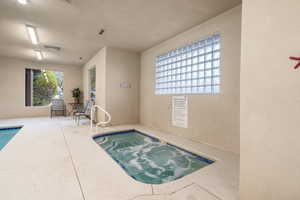 View of pool featuring an indoor in ground hot tub