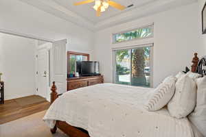 Bedroom with hardwood / wood-style floors and ceiling fan