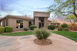 View of front of property featuring a lawn