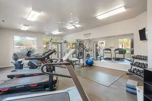 Workout area featuring ceiling fan