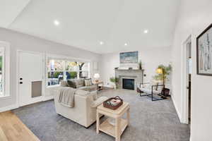 Living room with hardwood / wood-style flooring