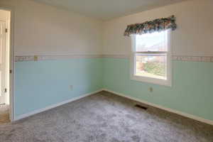 View of carpeted spare room