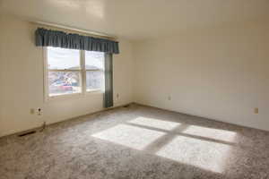 Unfurnished room featuring carpet floors