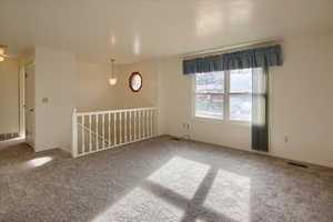 View of carpeted spare room