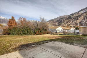 View of yard featuring a patio area and a mountain view