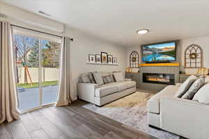 Living room with wood-type flooring