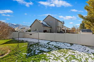 Snowy yard featuring a mountain view