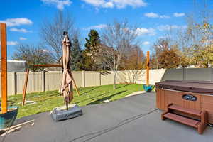 View of patio / terrace featuring a hot tub