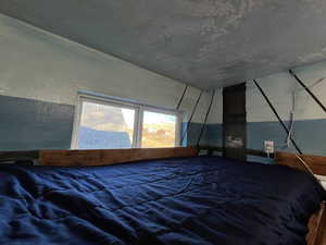 Unfurnished bedroom with a textured ceiling