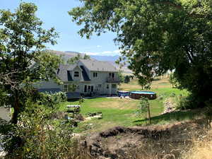 Rear view of house from the forested mountain area