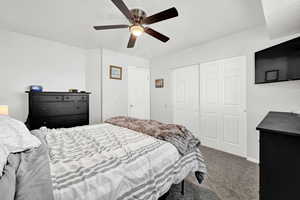 Bedroom featuring carpet floors, a closet, and ceiling fan