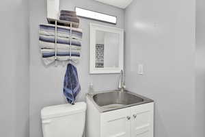 Lower level Bathroom with vanity and toilet