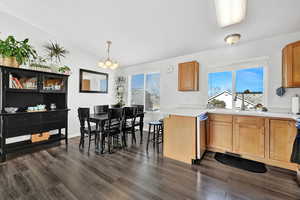 Kitchen featuring sink, laminate flooring, stainless steel dishwasher