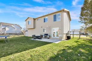 Rear view of property featuring a patio