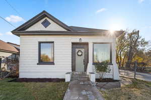 Bungalow-style house featuring a front yard