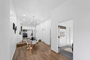 Dining area featuring a chandelier and hardwood / wood-style flooring