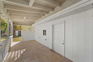 View of patio featuring a storage unit