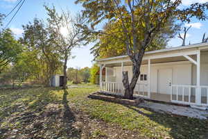 View of yard with covered porch