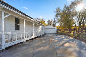 View of patio / terrace with an outbuilding and a garage