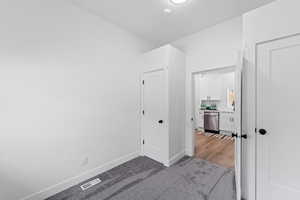 Corridor featuring hardwood / wood-style floors