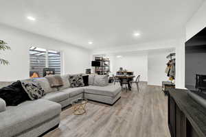 Living room with light wood-type flooring