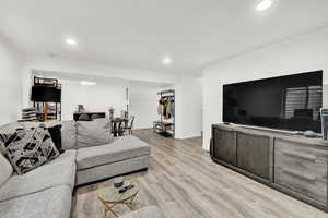 Living room with light hardwood / wood-style floors