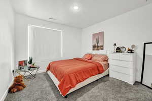 Bedroom featuring carpet flooring