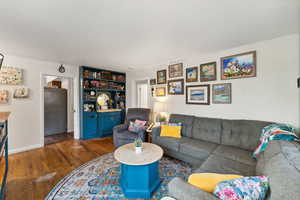 Living room with dark hardwood / wood-style floors