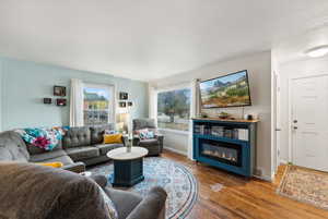 Living room with hardwood / wood-style floors