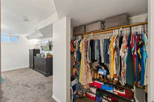 Walk in closet featuring carpet