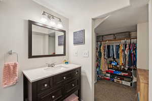 Bathroom featuring vanity and a textured ceiling