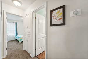 Hallway with carpet flooring